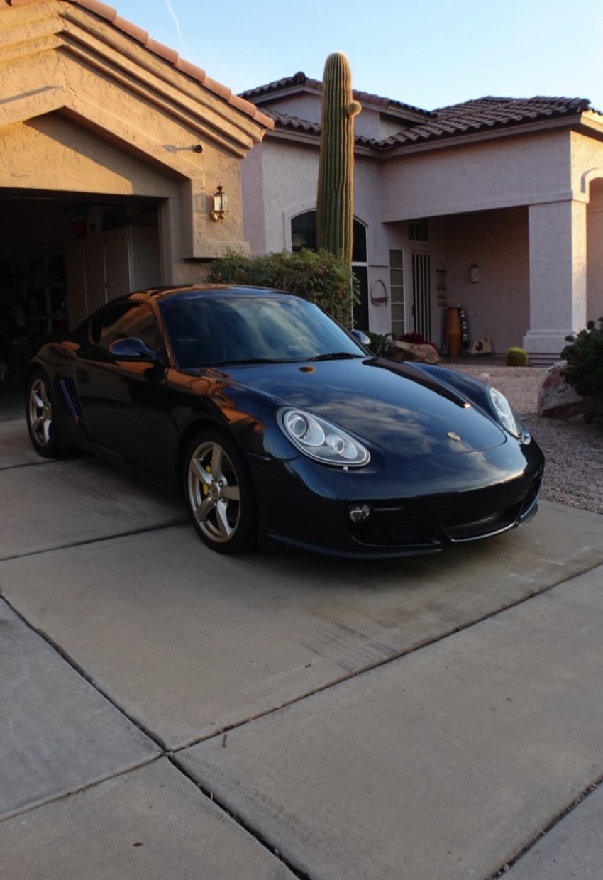 Black Porsche Cayman mobile detail in Scottsdale driveway