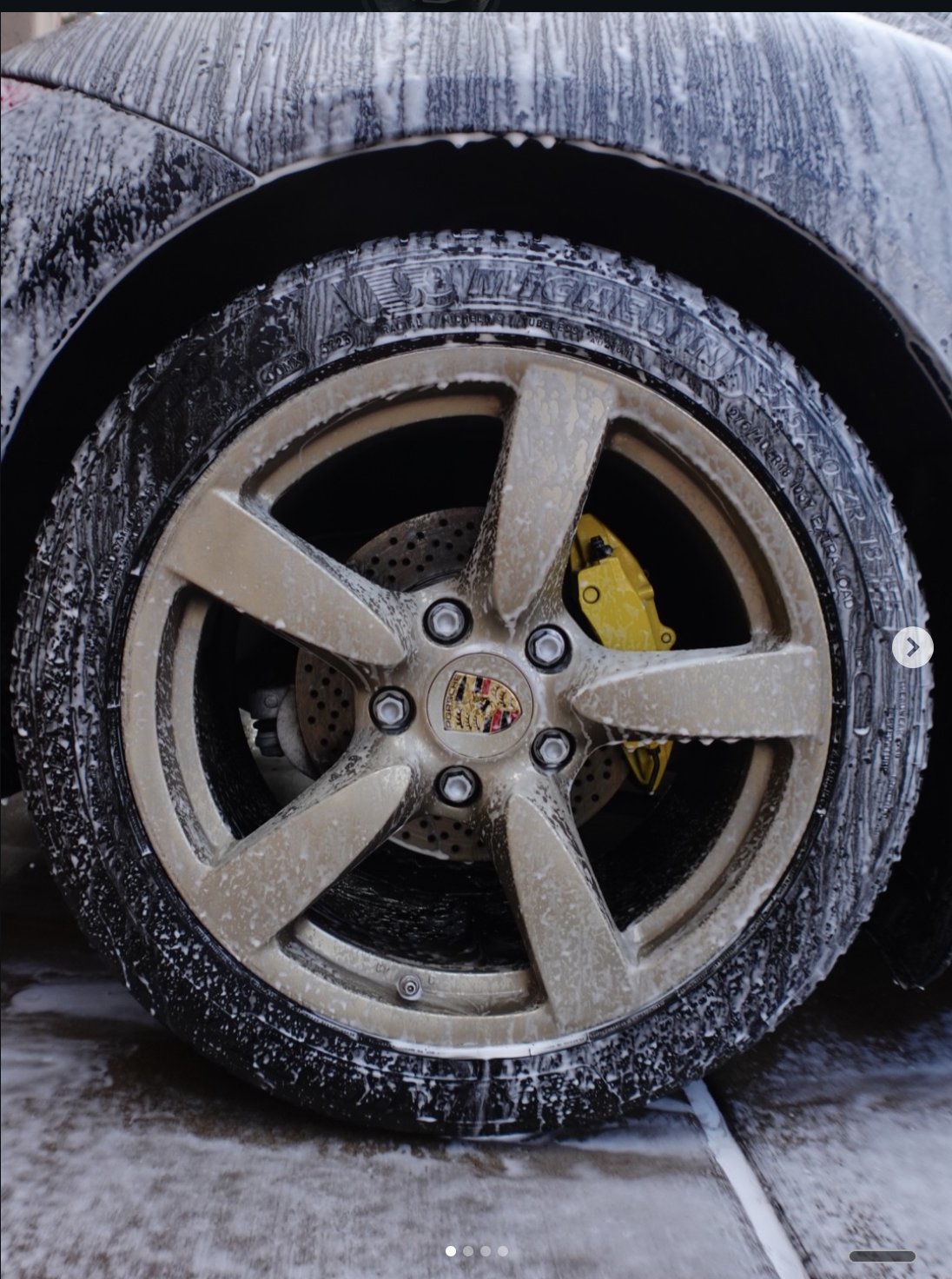 Porsche wheel and brake caliper detail close-up